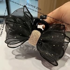 Elegant Black Hair Clip with Gold Accent